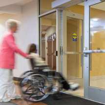 wheelchair passing through a touchless automatic door